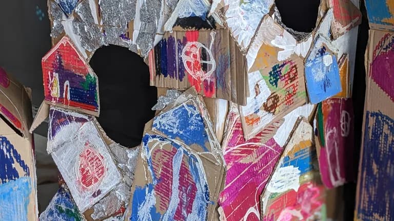 cardboard houses decorated with paint, glue and semolina